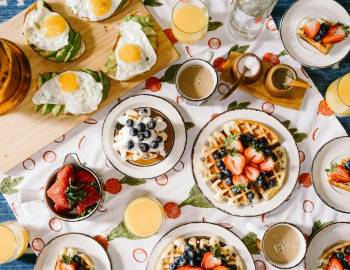 Eggs, waffles, and toast on the table