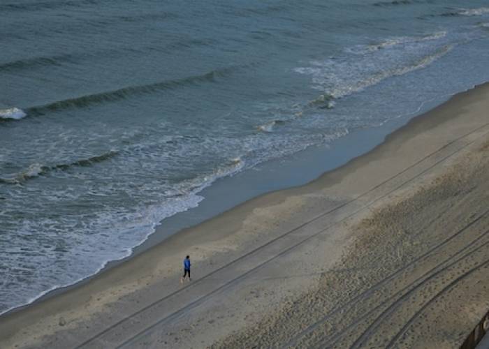 woman jogging on the beach