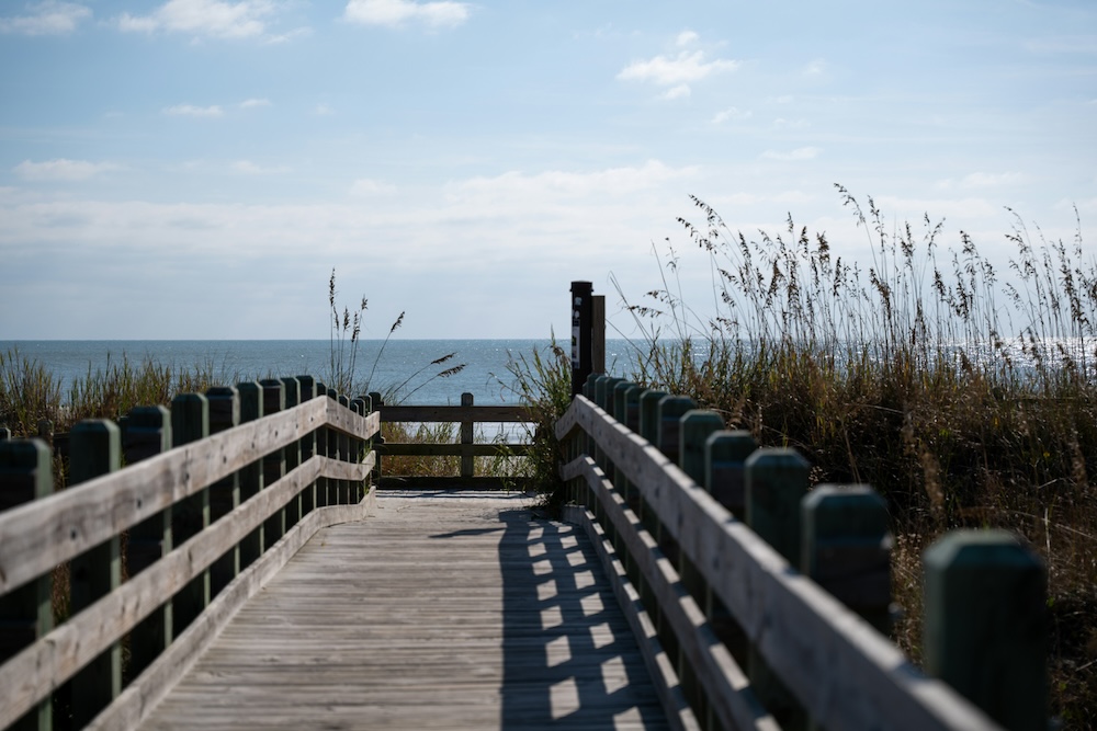 Boardwalk leading to the beach from a garden city beach vacation rental