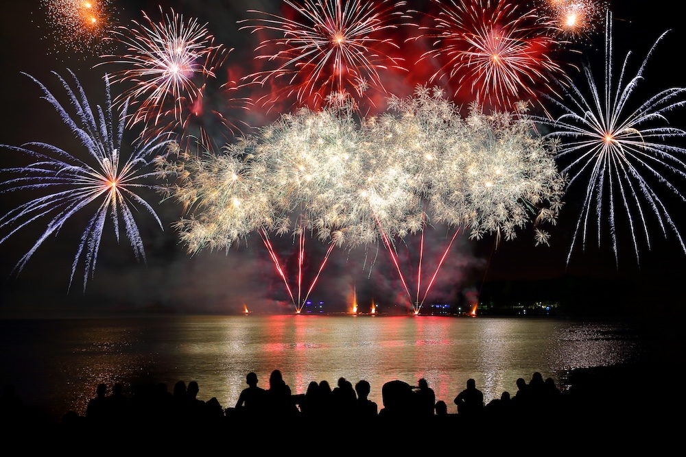 Group watching fireworks from the pier